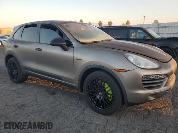✅ 2012 Porsche Cayenne S Hybrid • VIN: WP1AE2A29CLA90588 • Lot: 67027525. Listed on Copart with 103,568 mi. Free auction sales archive from the USA and detailed vehicle history report at DreamBid. Image 4.