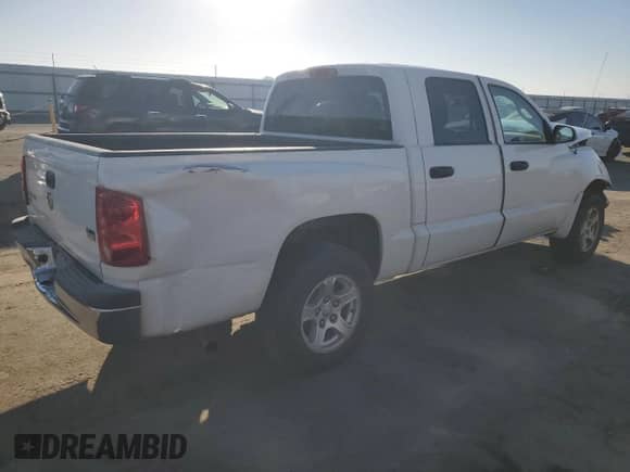 2006 Dodge Dakota SLT с VIN 1D7HE48N46S502721, выставлен на аукционе Copart как лот 77704414 с пробегом 195 514 миль миль и Списание • Salvage title. История ставок и продаж доступна на DreamBid. Изображение 3.