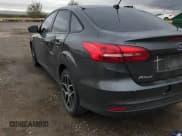 ✅ 2018 Ford Focus SE • VIN: 1FADP3FE9JL270576 • Lot: 86282885. Wystawiony na Copart z przebiegiem 89 128 mil. Bezpłatny archiwum sprzedaży aukcyjnych z USA i szczegółowy raport historii pojazdu na DreamBid. Zdjęcie 14.