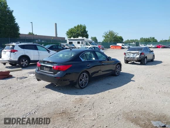 ✅ 2014 Infiniti Q50 Hybrid Premium • VIN: JN1AV7ARXEM702681 • Lot: 42602182. Listed on IAAI with 105,841 mi. Free auction sales archive from the USA and detailed vehicle history report at DreamBid. Image 4.