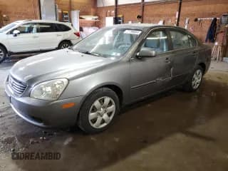 ✅ 2006 Kia Optima LX • VIN: KNAGE123065038933 • Лот: 77798664. Опубликован ранее на Copart с пробегом 203 900 миль. Бесплатный доступ к архиву аукционных продаж из США и подробный отчёт об истории автомобиля на DreamBid. Изображение 1.