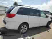 2009 Toyota Sienna LE with VIN 5TDBK23C19S023009, listed as a Copart auction lot 56470755 with 285,574 mi miles and Salvage title. Bid and sale history available at DreamBid. Image 3.