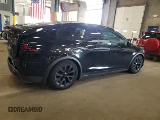 ✅ 2023 Tesla Model X • VIN: 7SAXCDE58PF427636 • Лот: 81063615. Опубликован ранее на Copart с пробегом 14 746 миль. Бесплатный доступ к архиву аукционных продаж из США и подробный отчёт об истории автомобиля на DreamBid. Изображение 3.