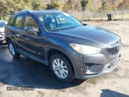 ✅ 2014 Mazda CX-5 Sport • VIN: JM3KE2BE0E0339810 • Lot: 43657362. Listed on IAAI with 198,849 mi. Free auction sales archive from the USA and detailed vehicle history report at DreamBid. Image 1.