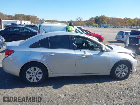 ✅ 2014 Chevrolet Cruze LS • VIN: 1G1PA5SG7E7358593 • Лот: 43521732. Опубликован ранее на IAAI с пробегом 95 574 миль. Бесплатный доступ к архиву аукционных продаж из США и подробный отчёт об истории автомобиля на DreamBid. Изображение 13.