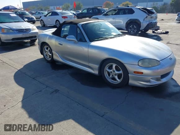 ✅ 2001 Mazda MX-5 Miata • VIN: JM1NB353110208734 • Lot: 43904436. Listed on IAAI with 99,908 mi. Free auction sales archive from the USA and detailed vehicle history report at DreamBid. Image 1.