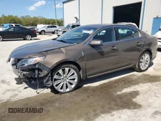 ✅ 2015 Lincoln MKS EcoBoost • VIN: 1LNHL9FT0FG602960 • Лот: 47478715. Опубликован ранее на Copart с пробегом 94 781 миль. Бесплатный доступ к архиву аукционных продаж из США и подробный отчёт об истории автомобиля на DreamBid. Изображение 1.