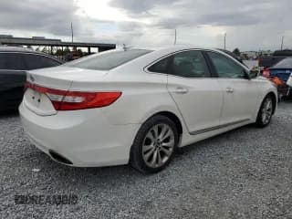 ✅ 2014 Hyundai Azera • VIN: KMHFG4JG9EA419079 • Лот: 61906195. Опубликован ранее на Copart с пробегом 159 334 миль. Бесплатный доступ к архиву аукционных продаж из США и подробный отчёт об истории автомобиля на DreamBid. Изображение 3.