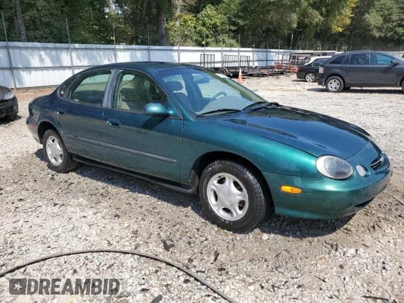 ✅ 1999 Ford Taurus SE • VIN: 1FAFP53U0XG112855 • Lot: 80790835. Wystawiony na Copart z przebiegiem 163 262 mil. Bezpłatny archiwum sprzedaży aukcyjnych z USA i szczegółowy raport historii pojazdu na DreamBid. Zdjęcie 4.