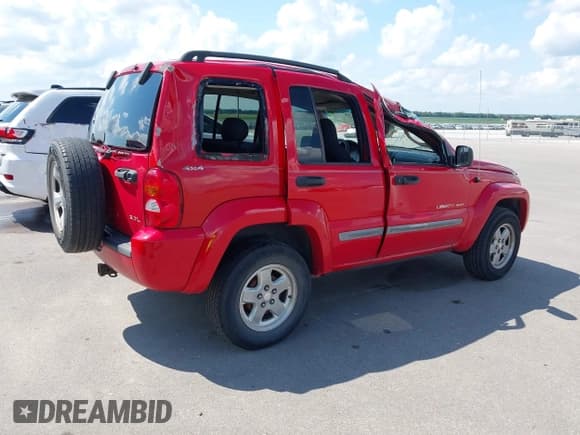 ✅ 2002 Jeep Liberty Sport • VIN: 1J4GL48K52W128974 • Lot: 42967520. Listed on IAAI with 109,183 mi. Free auction sales archive from the USA and detailed vehicle history report at DreamBid. Image 4.