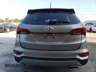 ✅ 2018 Hyundai Santa Fe 2.4L • VIN: 5NMZT3LB6JH095209 • Лот: 66211623. Опубликован ранее на Copart с пробегом 57 947 миль. Бесплатный доступ к архиву аукционных продаж из США и подробный отчёт об истории автомобиля на DreamBid. Изображение 6.