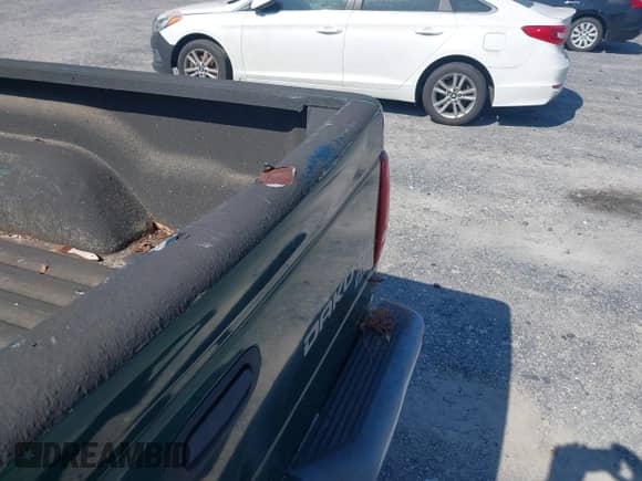 2003 Dodge Dakota SLT with VIN 1D7HL42N63S126307, listed as a IAAI auction lot 42805121 with 150,515 mi miles and . Bid and sale history available at DreamBid. Image 6.