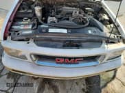 ✅ 1997 GMC Jimmy SLT • VIN: 1GKDT13W0V2549003 • Lot: 63618365. Listed on Copart with 230,977 mi. Free auction sales archive from the USA and detailed vehicle history report at DreamBid. Image 12.