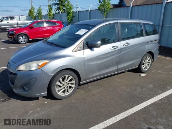 ✅ 2012 Mazda 5 Sport • VIN: JM1CW2BL3C0115906 • Lot: 42062899. Listed on IAAI with 124,286 mi. Free auction sales archive from the USA and detailed vehicle history report at DreamBid. Image 2.