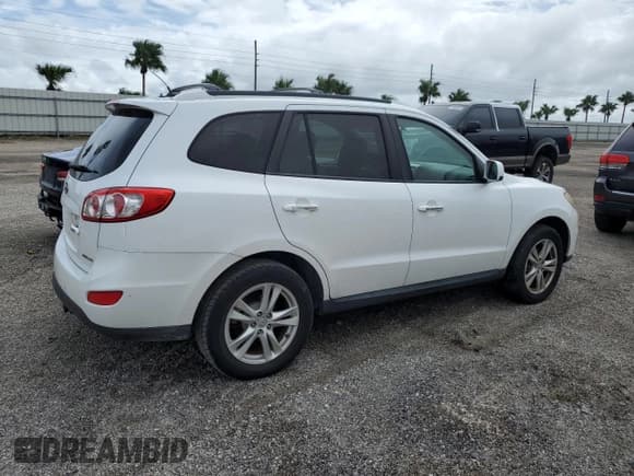 ✅ 2012 Hyundai Santa Fe Limited • VIN: 5XYZKDAG1CG143185 • Lot: 74531934. Listed on Copart with 186,312 mi. Free auction sales archive from the USA and detailed vehicle history report at DreamBid. Image 3.