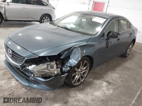 ✅ 2014 Mazda 6 i Grand Touring • VIN: JM1GJ1W67E1159404 • Lot: 42702402. Listed on IAAI with 107,039 mi. Free auction sales archive from the USA and detailed vehicle history report at DreamBid. Image 2.