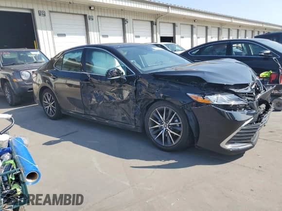 2023 Toyota Camry Hybrid XLE with VIN 4T1F31AK7PU602352, listed as a Copart auction lot 68065355 with 50,155 mi miles and Salvage title. Bid and sale history available at DreamBid. Image 4.