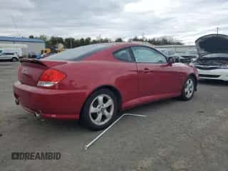 ✅ 2006 Hyundai Tiburon GS • VIN: KMHHM65D86U203902 • Лот: 85872545. Опубликован ранее на Copart с пробегом 102 778 миль. Бесплатный доступ к архиву аукционных продаж из США и подробный отчёт об истории автомобиля на DreamBid. Изображение 3.