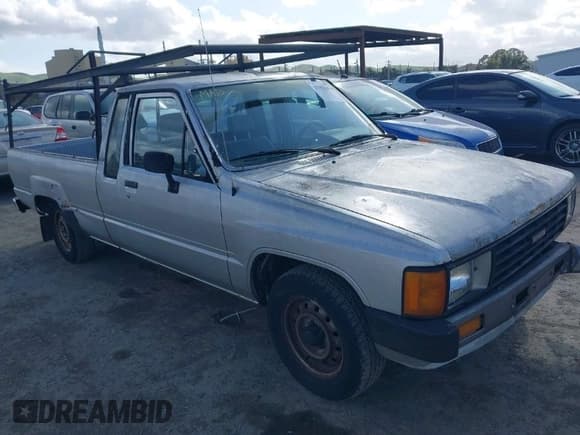 ✅ 1986 Toyota Pickup • VIN: JT4RN70D3G0008690 • Lot: 41913456. Listed on IAAI with 103,682 mi. Free auction sales archive from the USA and detailed vehicle history report at DreamBid. Image 1.