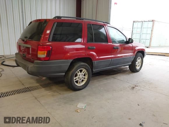 ✅ 2003 Jeep Grand Cherokee Laredo • VIN: 1J4GW48S73C513334 • Lot: 43616381. Listed on IAAI with Not provided. Free auction sales archive from the USA and detailed vehicle history report at DreamBid. Image 4.
