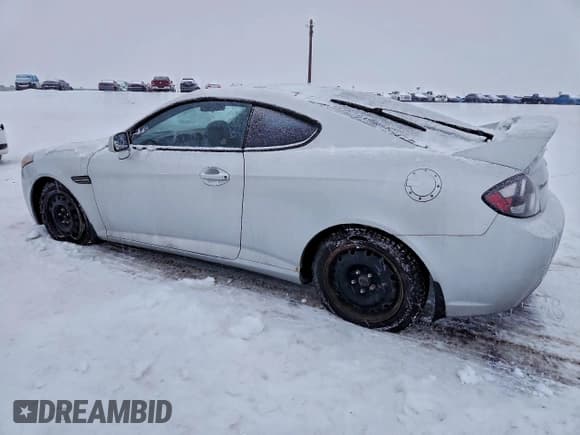 ✅ 2007 Hyundai Tiburon GT • VIN: KMHHN65F57U247209 • Лот: 85445885. Опубликован ранее на Copart с пробегом 137 418 миль. Бесплатный доступ к архиву аукционных продаж из США и подробный отчёт об истории автомобиля на DreamBid. Изображение 2.