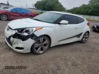 2013 Hyundai Veloster w/Black Int с VIN KMHTC6AD6DU145921, выставлен на аукционе Copart как лот 68556835 с пробегом 91 117 миль миль и Списание • Salvage title. История ставок и продаж доступна на DreamBid. Изображение 1.