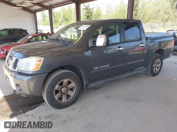 ✅ 2005 Nissan Titan LE • VIN: 1N6AA07B75N553857 • Lot: 42110183. Listed on IAAI with 166,064 mi. Free auction sales archive from the USA and detailed vehicle history report at DreamBid. Image 2.
