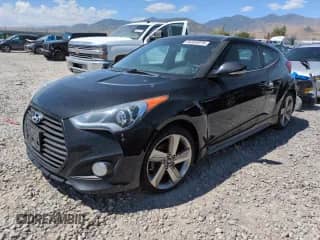 2013 Hyundai Veloster Turbo с VIN KMHTC6AE6DU177888, выставлен на аукционе Copart как лот 64332075 с пробегом 149 786 миль миль и Чистый • Clean title. История ставок и продаж доступна на DreamBid. Изображение 1.