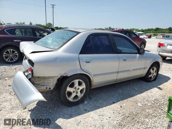✅ 1999 Mazda Protege ES • VIN: JM1BJ2216X0137767 • Lot: 59116315. Wystawiony na Copart z przebiegiem 184 684 mil. Bezpłatny archiwum sprzedaży aukcyjnych z USA i szczegółowy raport historii pojazdu na DreamBid. Zdjęcie 3.