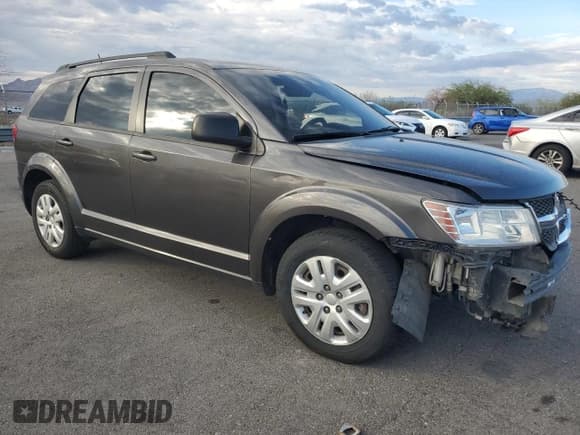 ✅ 2016 Dodge Journey SE • VIN: 3C4PDCAB0GT240358 • Lot: 86099105. Listed on Copart with 201,276 mi. Free auction sales archive from the USA and detailed vehicle history report at DreamBid. Image 4.