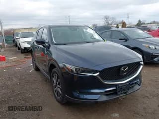 ✅ 2018 Mazda CX-5 Grand Touring • VIN: JM3KFBDM5J0426677 • Lot: 43579829. Listed on IAAI with 94,077 mi. Free auction sales archive from the USA and detailed vehicle history report at DreamBid. Image 1.