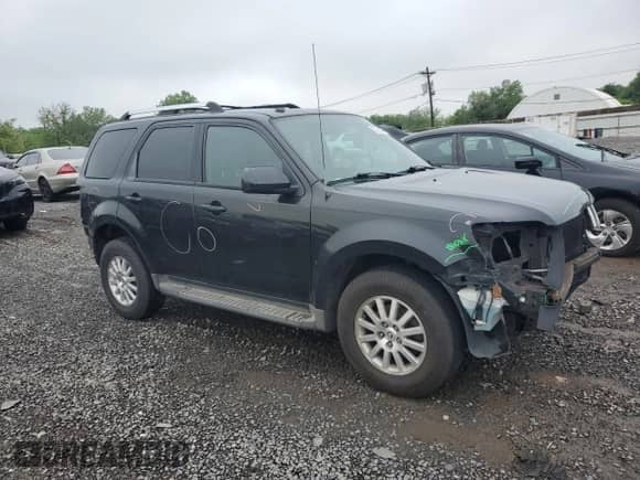 2011 Mercury Mariner Premier with VIN 4M2CN9HG1BKJ00209, listed as a Copart auction lot 57016475 with 224,019 mi miles and Salvage title. Bid and sale history available at DreamBid. Image 4.