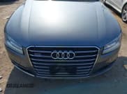 ✅ 2015 Audi A8 • VIN: WAUJGAFD0FN006762 • Lot: 42975851. Wystawiony na IAAI z przebiegiem 129 261 mil. Bezpłatny archiwum sprzedaży aukcyjnych z USA i szczegółowy raport historii pojazdu na DreamBid. Zdjęcie 6.