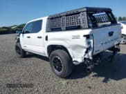 ✅ 2024 Toyota Tacoma TRD Sport Hybrid • VIN: 3TYLC5LN3RT001392 • Lot: 42401518. Listed on IAAI with 3,310 mi. Free auction sales archive from the USA and detailed vehicle history report at DreamBid. Image 3.