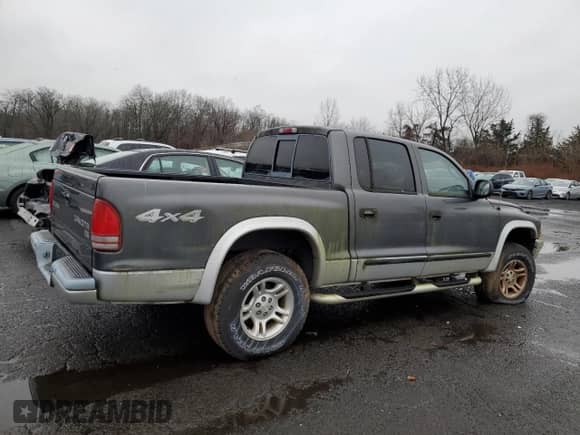 2004 Dodge Dakota SLT z VIN 1D7HG48K64S556101, wystawiony jako Copart lot #83773434 z przebiegiem Nie podano mil oraz Nie do naprawy • Non repairable. Historia ofert i sprzedaży dostępna na DreamBid. Obrazek 3.