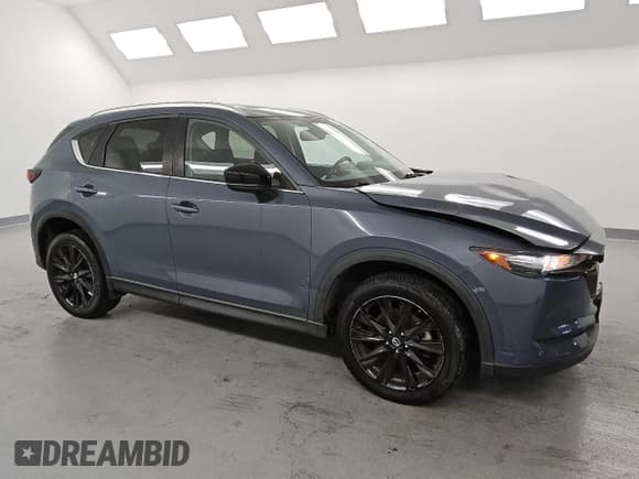 ✅ 2021 Mazda CX-5 Carbon Edition • VIN: JM3KFACY6M0410510 • Lot: 58585435. Listed on Copart with 56,319 mi. Free auction sales archive from the USA and detailed vehicle history report at DreamBid. Image 4.