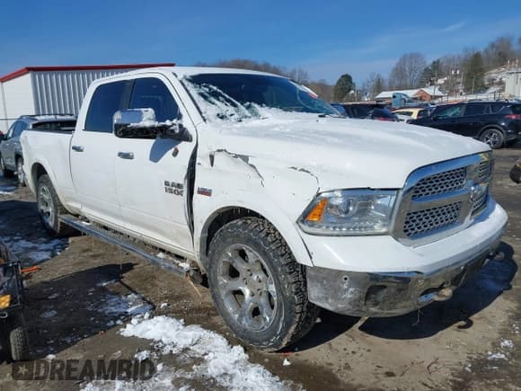 ✅ 2018 Ram 1500 Laramie • VIN: 1C6RR7VT2JS180586 • Lot: 41570976. Listed on IAAI with 175,598 mi. Free auction sales archive from the USA and detailed vehicle history report at DreamBid. Image 1.