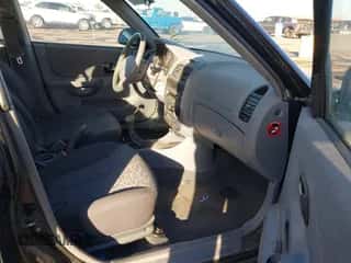 2005 Hyundai Accent GLS z VIN KMHCG45C75U632587, wystawiony jako IAAI lot #40946829 z przebiegiem 114 666 mil mil oraz . Historia ofert i sprzedaży dostępna na DreamBid. Obrazek 5.