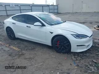✅ 2023 Tesla Model S Plaid • VIN: 5YJSA1E63PF521945 • Lot: 43248046. Listed on IAAI with 26,327 mi. Free auction sales archive from the USA and detailed vehicle history report at DreamBid. Image 1.