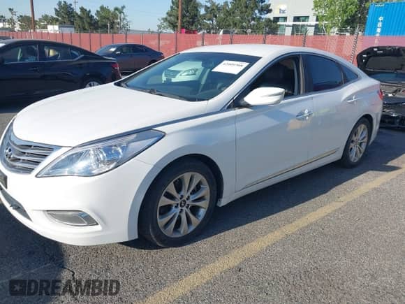 2012 Hyundai Azera z VIN KMHFG4JG5CA152696, wystawiony jako IAAI lot #42009308 z przebiegiem 133 068 mil mil oraz . Historia ofert i sprzedaży dostępna na DreamBid. Obrazek 2.