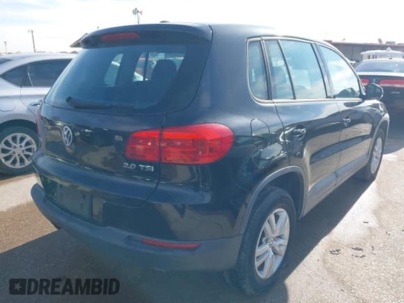✅ 2013 Volkswagen Tiguan S • VIN: WVGAV3AX1DW591585 • Lot: 43845445. Listed on IAAI with 125,297 mi. Free auction sales archive from the USA and detailed vehicle history report at DreamBid. Image 4.