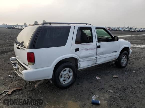 2002 Chevrolet Blazer LS z VIN 1GNDT13W12K169005, wystawiony jako Copart lot #84643884 z przebiegiem Nie podano mil oraz Szkoda całkowita • Salvage title. Historia ofert i sprzedaży dostępna na DreamBid. Obrazek 3.