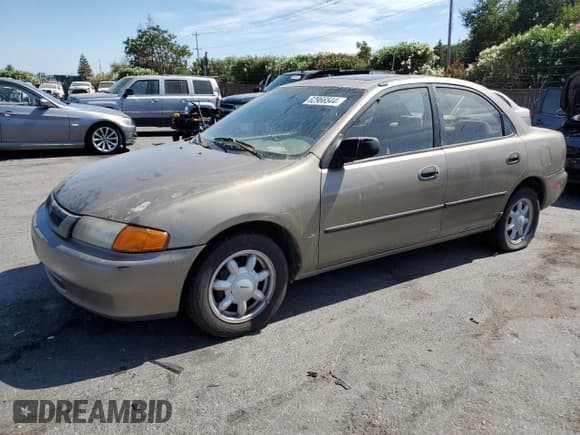 ✅ 1998 Mazda Protege DX • VIN: JM1BC1414W0203670 • Лот: 62966544. Опубликован ранее на Copart с пробегом 249 405 миль. Бесплатный доступ к архиву аукционных продаж из США и подробный отчёт об истории автомобиля на DreamBid. Изображение 1.