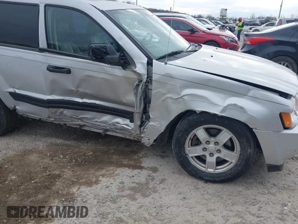 ✅ 2005 Jeep Grand Cherokee Laredo • VIN: 1J4GR48K95C661219 • Lot: 43694482. Listed on IAAI with 156,190 mi. Free auction sales archive from the USA and detailed vehicle history report at DreamBid. Image 6.