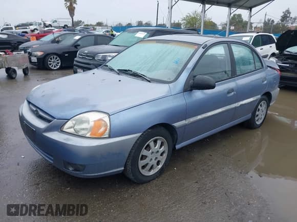 ✅ 2003 Kia Rio • VIN: KNADC125736223027 • Lot: 41797538. Listed on IAAI with 25,611 mi. Free auction sales archive from the USA and detailed vehicle history report at DreamBid. Image 2.