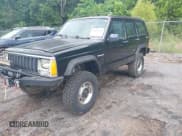 ✅ 1987 Jeep Cherokee • VIN: 1JCMR7819HT174249 • Lot: 42458110. Listed on IAAI with 157,683 mi. Free auction sales archive from the USA and detailed vehicle history report at DreamBid. Image 2.