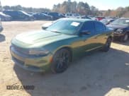 ✅ 2023 Dodge Charger SXT • VIN: 2C3CDXBG1PH592331 • Lot: 43713215. Listed on IAAI with 37,011 mi. Free auction sales archive from the USA and detailed vehicle history report at DreamBid. Image 2.