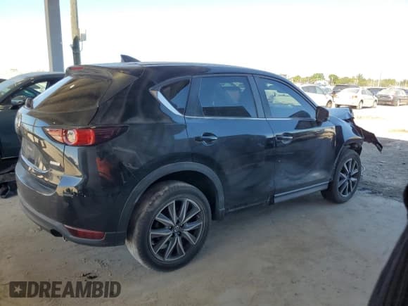 ✅ 2018 Mazda CX-5 Touring • VIN: JM3KFBCM6J0306985 • Lot: 91616465. Wystawiony na Copart z przebiegiem 106 570 mil. Bezpłatny archiwum sprzedaży aukcyjnych z USA i szczegółowy raport historii pojazdu na DreamBid. Zdjęcie 3.