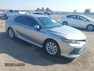 2023 Toyota Camry LE with VIN 4T1C11AK4PU147534, listed as a IAAI auction lot 43337127 with 11,969 mi miles and . Bid and sale history available at DreamBid. Image 1.