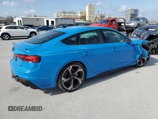 ✅ 2022 Audi RS 5 Sportback • VIN: WUAAWCF57NA901071 • Лот: 41744493. Опубликован ранее на Copart с пробегом 12 409 миль. Бесплатный доступ к архиву аукционных продаж из США и подробный отчёт об истории автомобиля на DreamBid. Изображение 3.